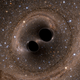 This computer simulation shows the collision of two black holes, which produces gravitational waves.